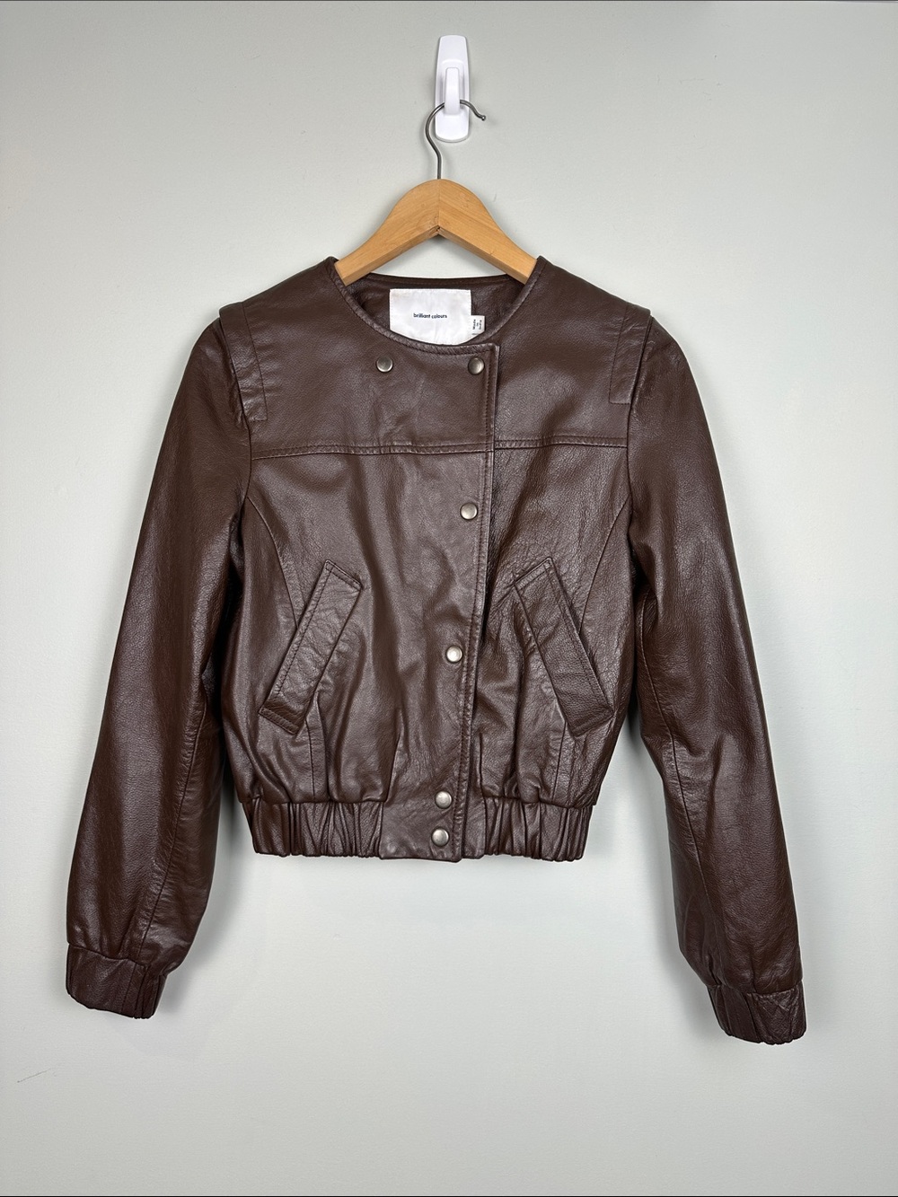 7. brilliant colors Brown, leather bomber jacket.